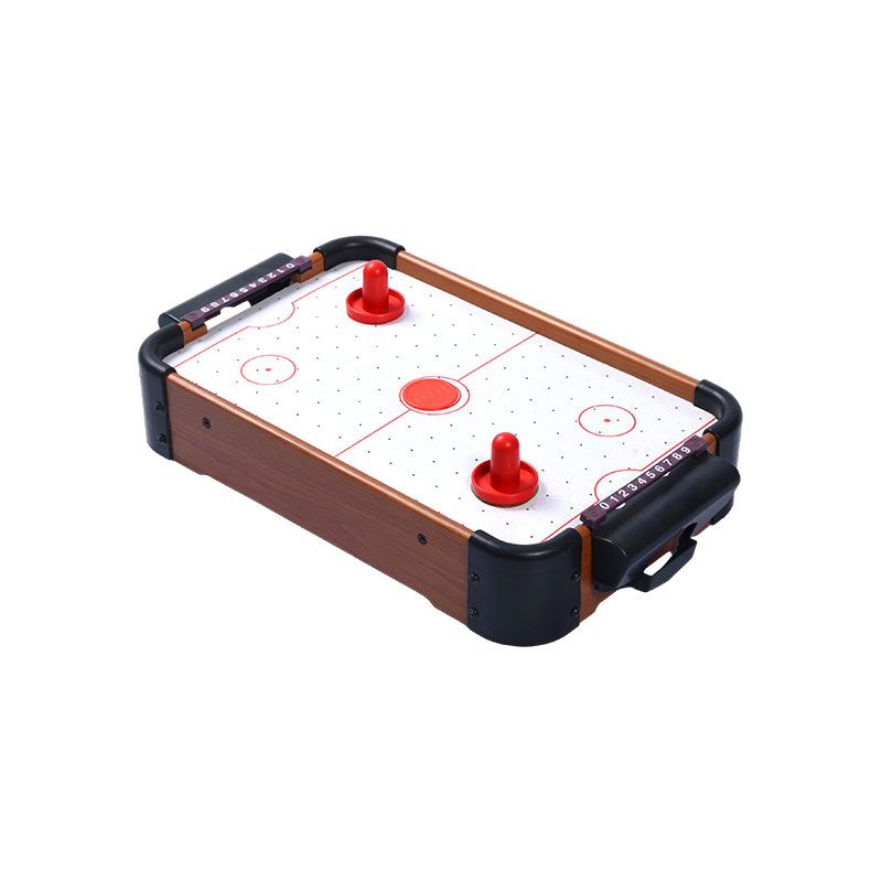 Mini-desktopspel met rode pucks en scoretrackers Compacte houten airhockeytafel